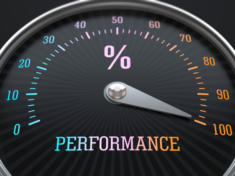 "Black performance meter with colorful numbers and a needle pointing towards a high percentage, representing success and efficiency."